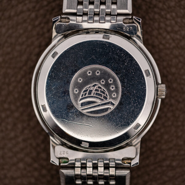 Omega Constellation 168.010 caseback showing observatory emblem, eight stars and stamped bracelet end links