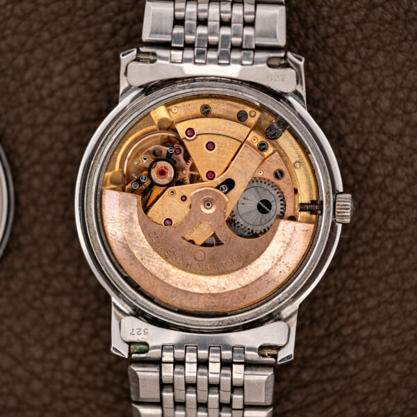 Omega Constellation 168.010 open movement overview with automatic rotor, jeweled bridges and attached bracelet