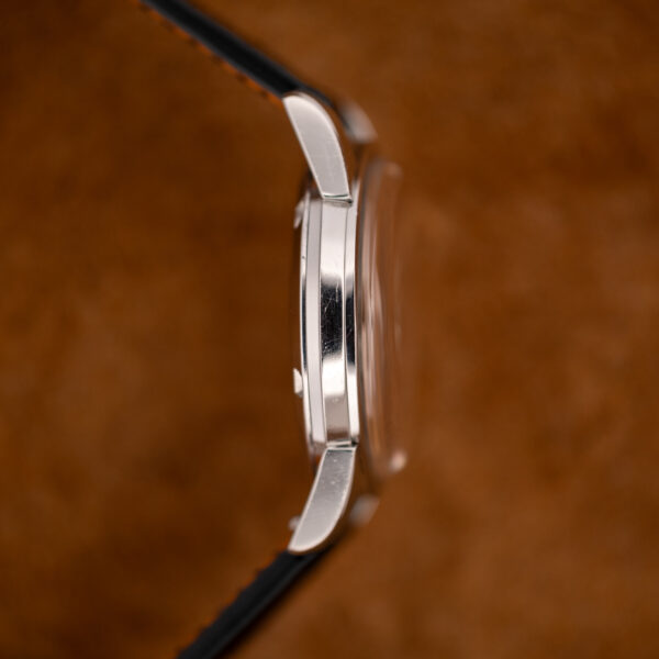 Opposite flank of the Omega Seamaster 14761 case showing curved lugs and the raised crystal