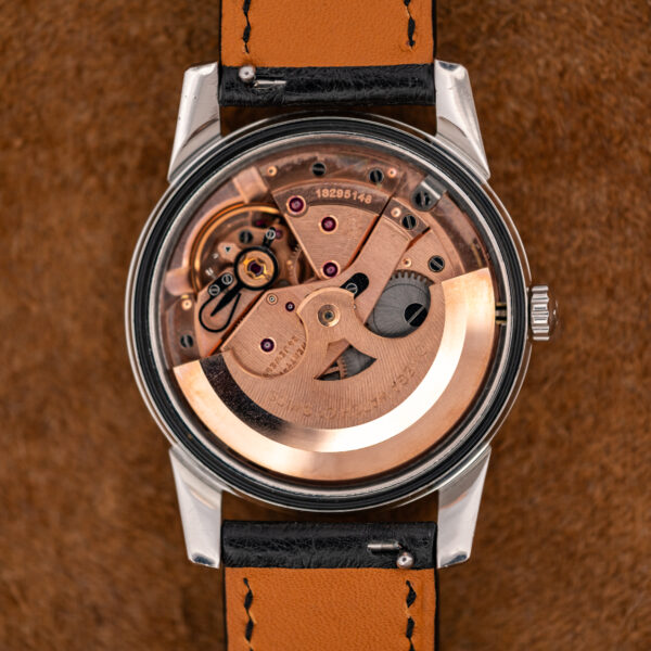 Omega caliber 552 automatic movement in the Seamaster 14761, with copper-tone bridges and signed rotor
