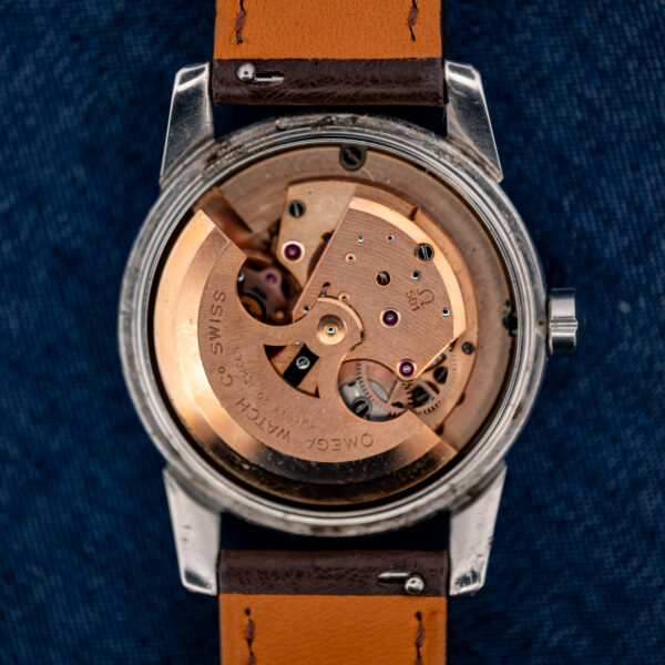 Omega caliber 501 automatic movement with rotor marked Twenty 20 Jewels inside the open steel case