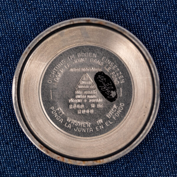 Inside caseback of the Omega 2846-15 SC with Patent 315164, 2848 stamp and four-language gasket instructions