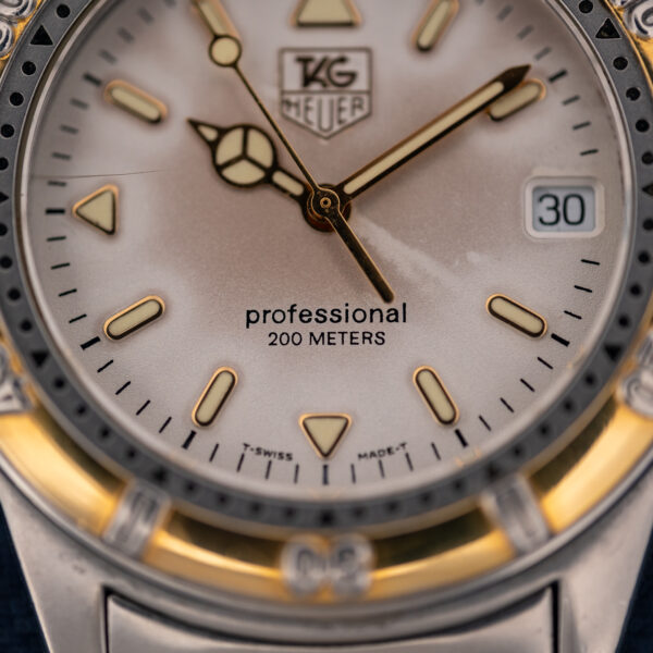 Lower dial of the TAG Heuer 995.706 K showing Professional, 200 Meters and T Swiss Made T printing