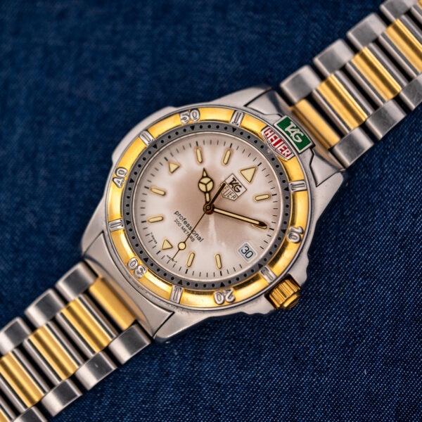 TAG Heuer 995.706 K front view with cream dial, date window, minute bezel and two-tone bracelet