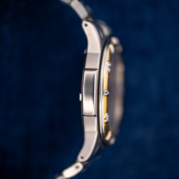Opposite flank of the TAG Heuer 995.706 K, showing the bezel edge and where the bracelet attaches