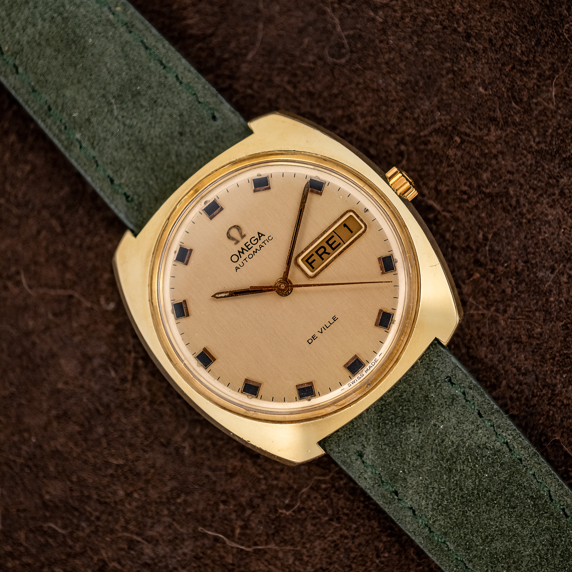 DSCF8134-Topaz-Sharpen-Strong-Denoise Omega De Ville 166.053 from a diagonal angle, champagne day-date dial and cushion case on green suede strap