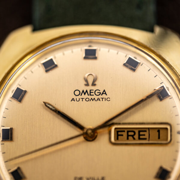 Upper dial of the Omega De Ville 166.053 showing the Omega Automatic signature and FRE 1 day-date window