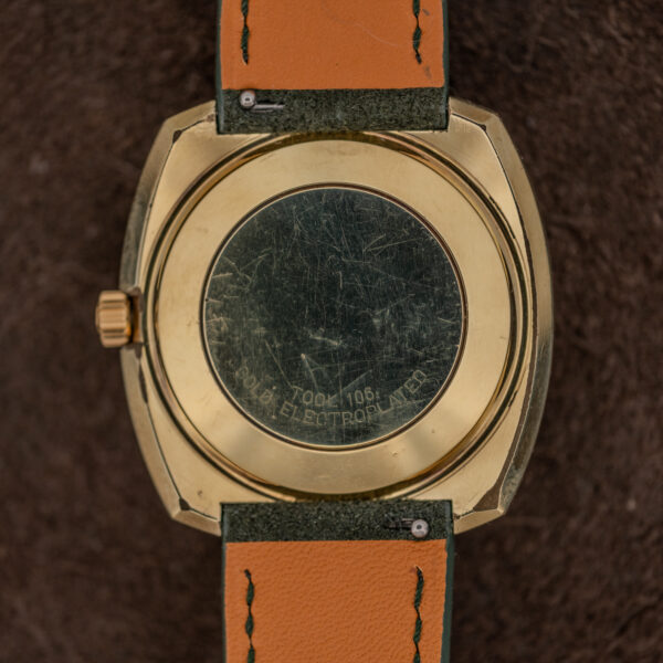 Underside of the Omega De Ville 166.053 cushion case with the Gold Electroplated inscription and scratched back