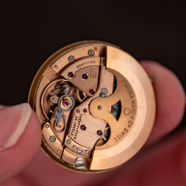 Omega caliber 752 automatic movement out of the case, showing rotor, caliber stamp and serial number