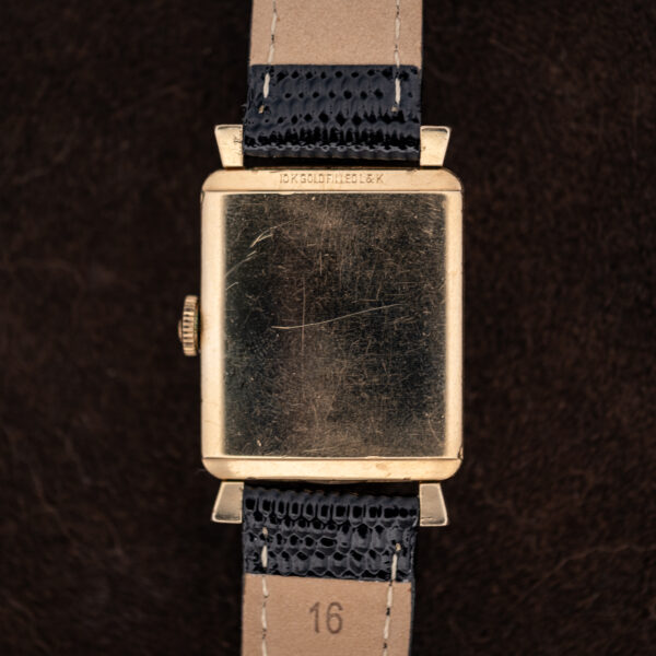 Back of the Wittnauer Revue showing the rectangular 10k gold-filled caseback and the underside of the strap