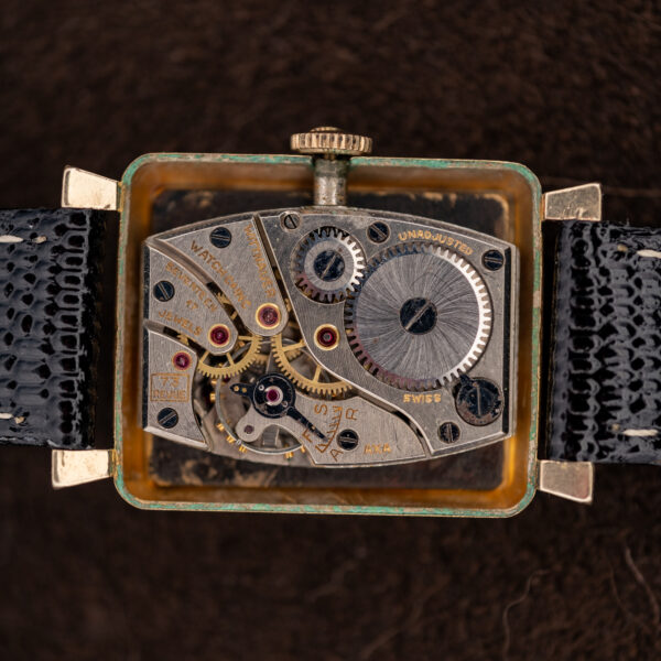 Open back of the Wittnauer Revue showing the shaped manual-wind caliber 73 movement and its bridges