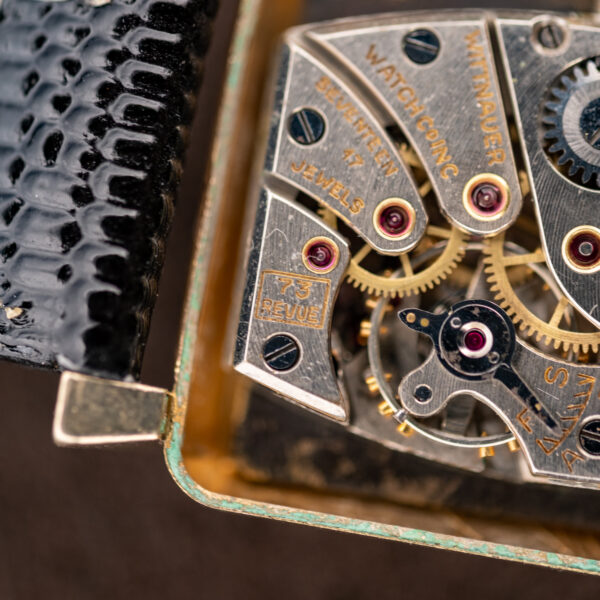 Close view of the Wittnauer movement engraving with the boxed 73 REVUE caliber stamp on the bridge