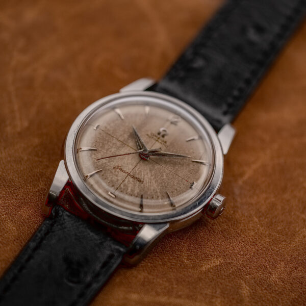 Three-quarter front of the Omega Seamaster 2846-1 SC showing arrowhead hour markers and black strap