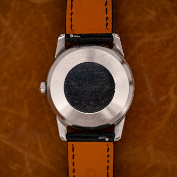 Outside caseback of the Omega Seamaster 2846-1 SC, its plain steel showing faint worn engraving