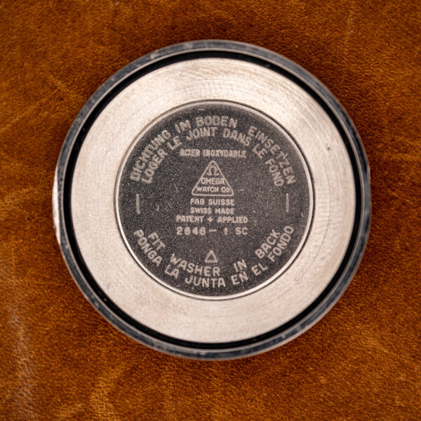 Inside caseback of the Omega 2846-1 SC with Patent Applied stamp and four-language gasket instructions