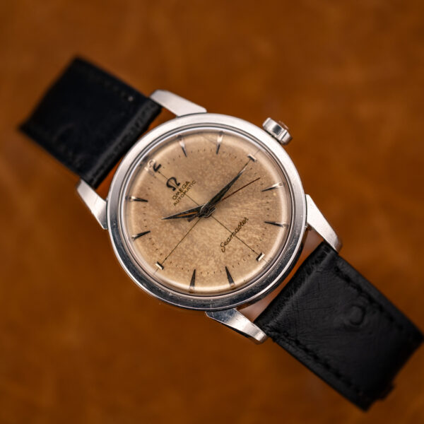 Omega Seamaster marbled dial and steel bezel seen from the opposite angle in raised view