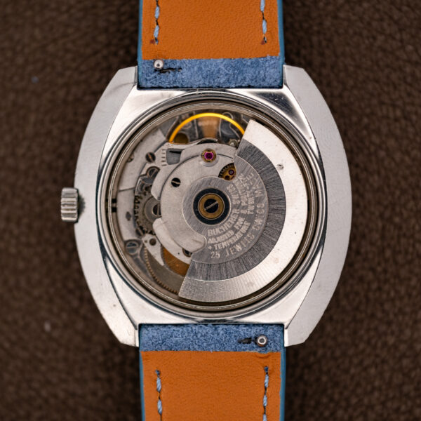 Open Bucherer 1574 case showing the signed automatic rotor over the 25-jewel movement