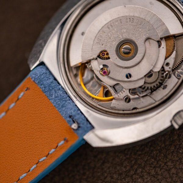 Bucherer automatic movement from a second angle, showing rotor, balance and the case rim