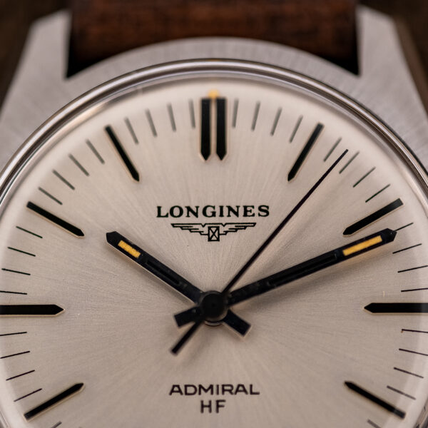 Upper half of the Longines Admiral HF dial with the printed winged hourglass, ADMIRAL HF text and baton hands
