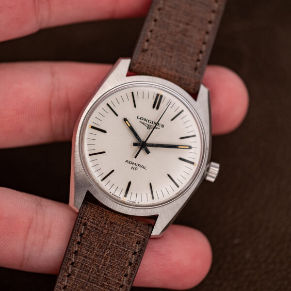 Handheld near-straight view of the Longines Admiral HF dial with ADMIRAL HF signature and T SWISS MADE T