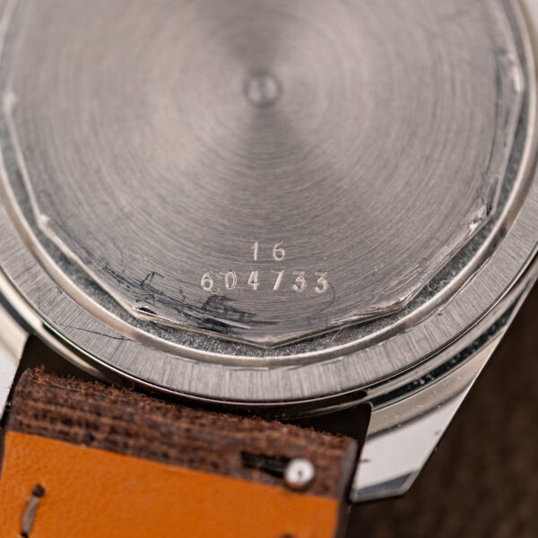 Macro of the Longines Admiral HF outer caseback engraved 16 and 604733 near the edge of the back