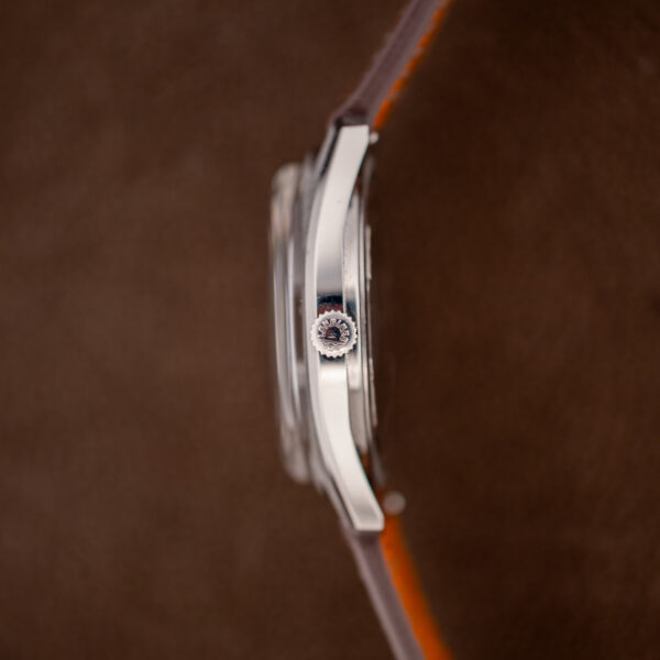 Crown-side profile of the Longines Admiral HF with the signed Longines crown, polished flank and raised crystal