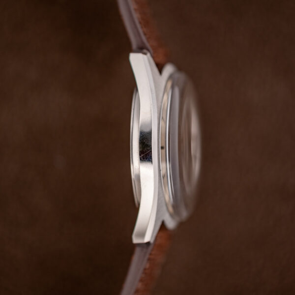 Profile of the Longines Admiral HF from the non-crown side, showing the curved case flank, crystal and lugs