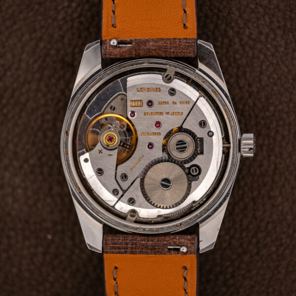 Longines caliber 6942 manual-wind movement inside the Admiral HF, engraved bridges and winding wheels visible
