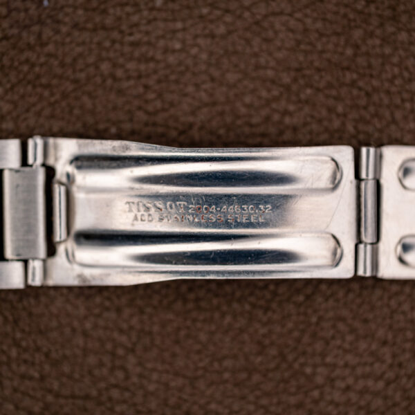 Inside of the Tissot folding clasp stamped TISSOT 2004-44630.32 and ALL STAINLESS STEEL