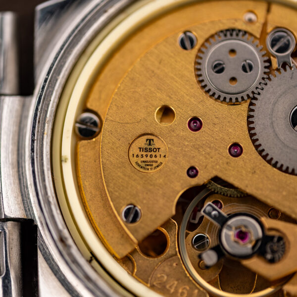 Tissot movement close-up with serial 16590614, UNADJUSTED and SEVENTEEN 17 JEWELS inscriptions