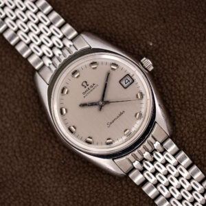 Omega Seamaster 166.067 at an angle on its steel bracelet, showing the silver date dial and tonneau case