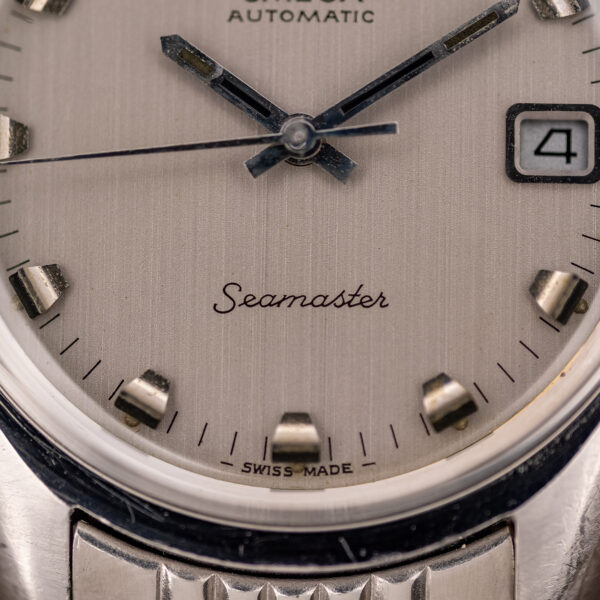 Lower dial detail of the Omega 166.067 showing Seamaster script, Swiss Made text and dark-banded markers