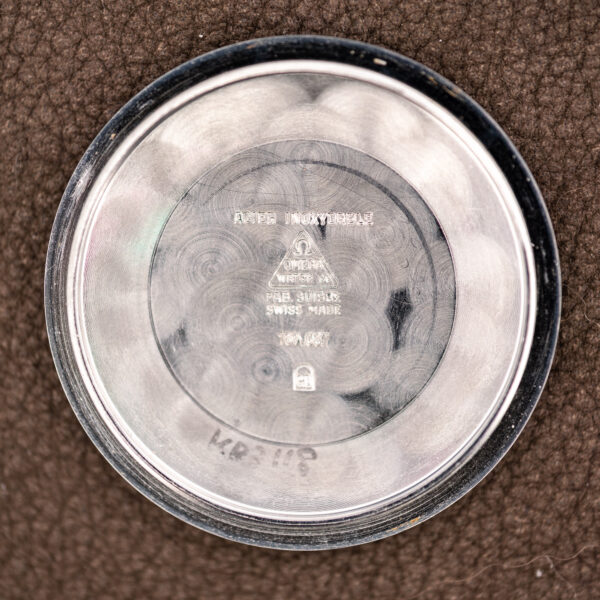 Inner caseback of the Omega Seamaster with ACIER INOXYDABLE and Omega stamps beside the reference number