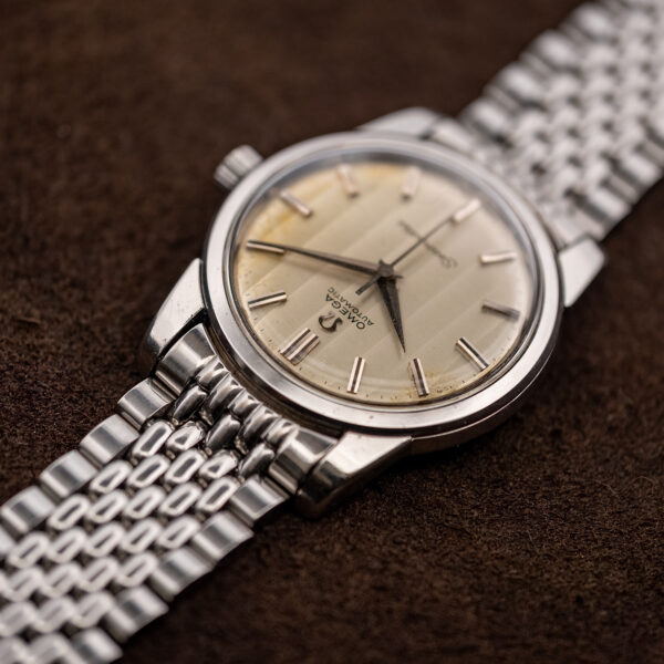 Low view from twelve o'clock across the Omega Seamaster 165.009 ribbon dial and domed crystal