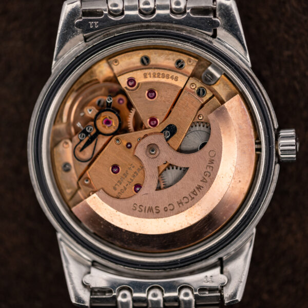Open case of the Omega Seamaster 165.009 showing the caliber 552 automatic movement and rotor