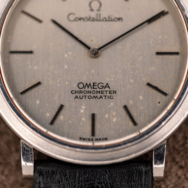 Close-up of the lower dial on the Omega Constellation 157.0001 with OMEGA CHRONOMETER AUTOMATIC text and pale flecks