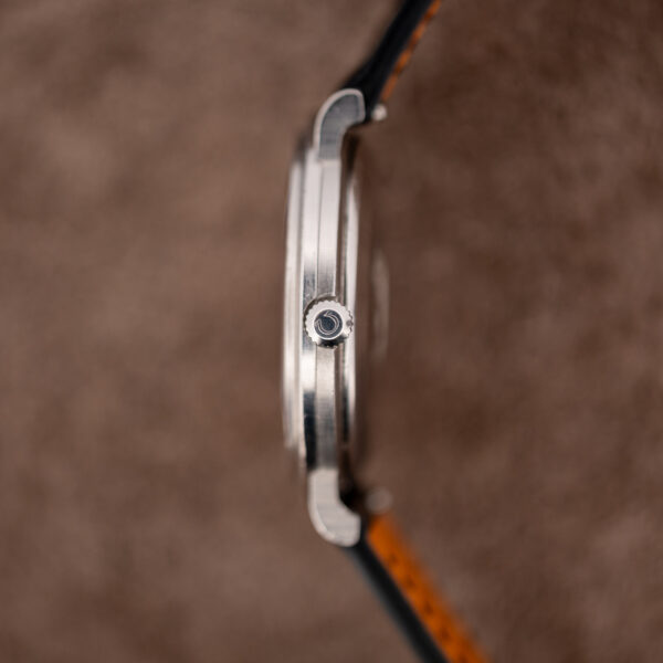 Crown-side profile of the Omega Constellation 157.0001, showing the Omega-signed crown and slim steel case
