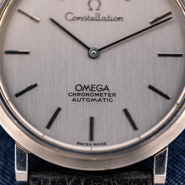Lower-dial macro of the Omega Constellation 157.0001 with OMEGA CHRONOMETER AUTOMATIC printing and vertical brushing