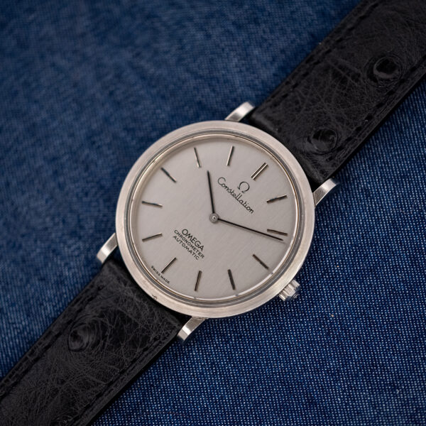 Omega Constellation 157.0001 laid flat with its black ostrich strap fully extended