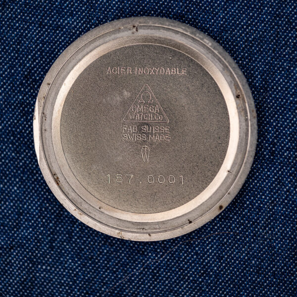 Inner caseback of the Omega Constellation stamped ACIER INOXYDABLE, FAB. SUISSE and the spaced reference 157 0001