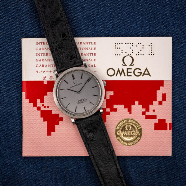 Omega Constellation 157.0001 lying on its red and white Omega International Guarantee booklet numbered 5321