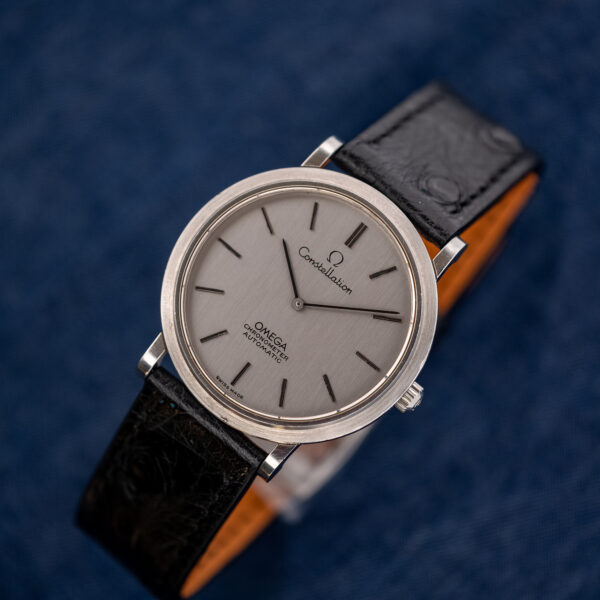Omega Constellation 157.0001 on a display stand, front view of the silver dial and steel case