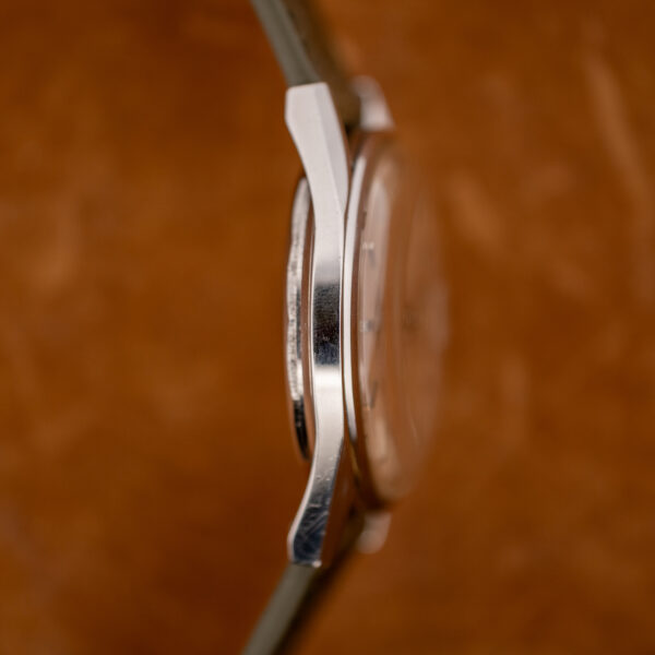 Profile of the Longines Conquest 7171-2 from the left, showing the polished case flank and curved lugs