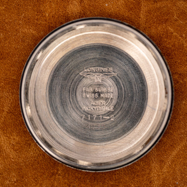 Inner caseback of the Longines Conquest 7171-2 stamped with the winged hourglass, reference and steel marking