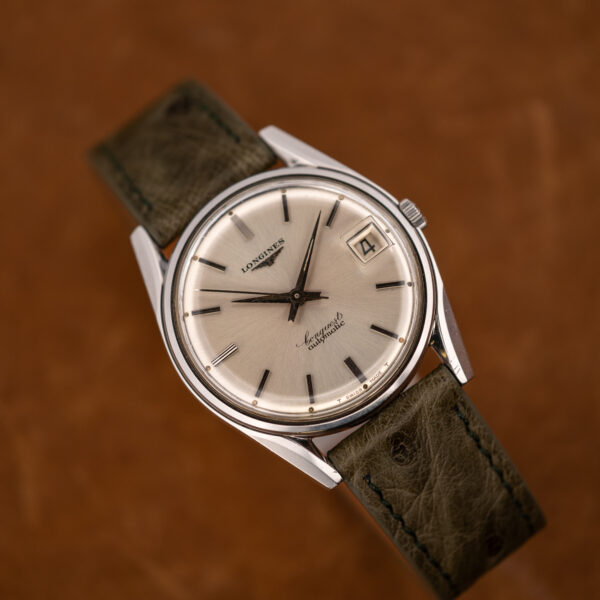 Reverse diagonal view of the Longines Conquest 7171-2 with its magnified date at three and center seconds
