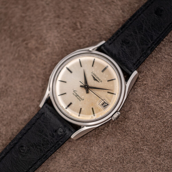 Wide diagonal view of the Longines Conquest 7171-5 steel case and black ostrich strap