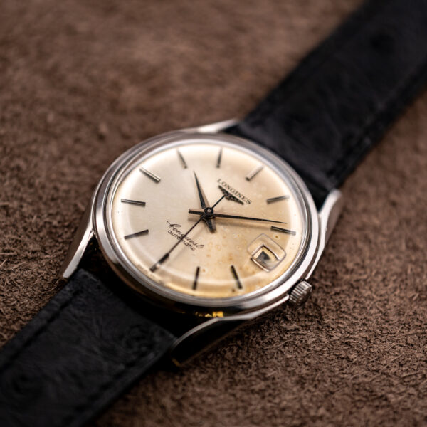 Low crown-side view of the Longines Conquest 7171-5 with its sunburst dial and center seconds hand