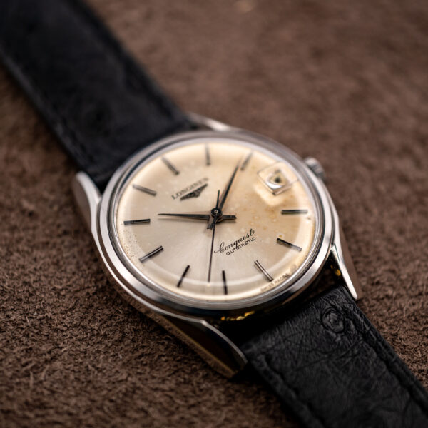 Low view from the opposite side of the Longines Conquest 7171-5 dial and steel case