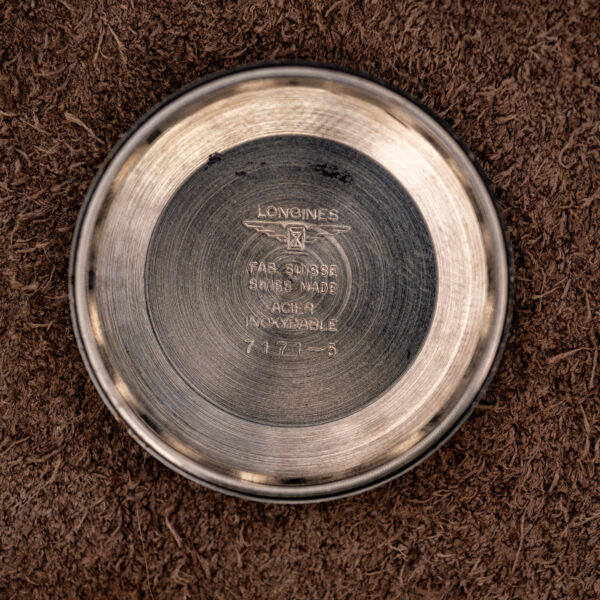 Inner caseback of the Longines Conquest 7171-5 stamped with the winged hourglass, 7171-5 and steel marking