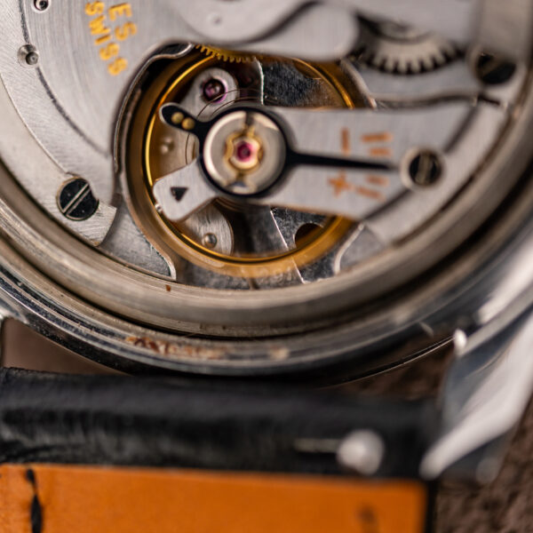 Balance and regulator of the Longines automatic movement inside the Conquest 7171-5, case open